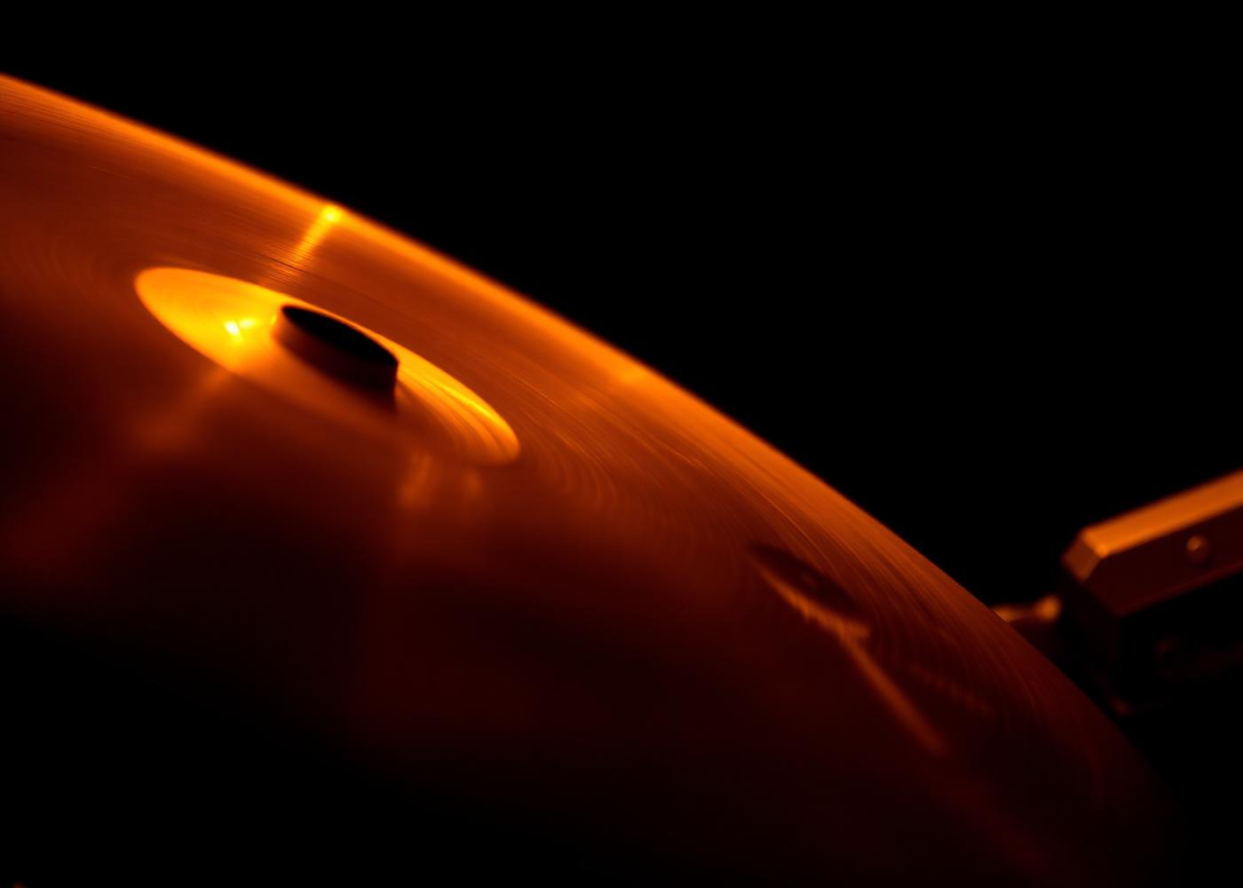 Bronze cymbal lit by warm stage light